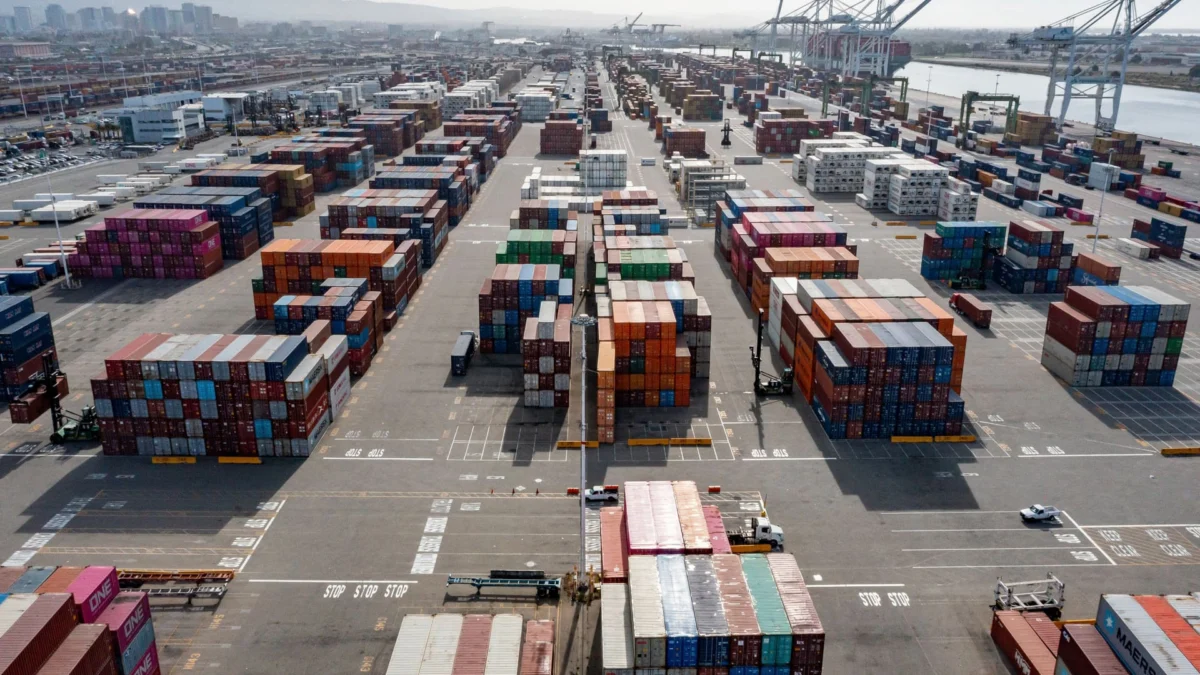 Containers are seen stacked at the Port of Oakland in Oakland, California, U.S., on Thursday, March 26, 2026. | David Paul Morris | Bloomberg | Getty Images