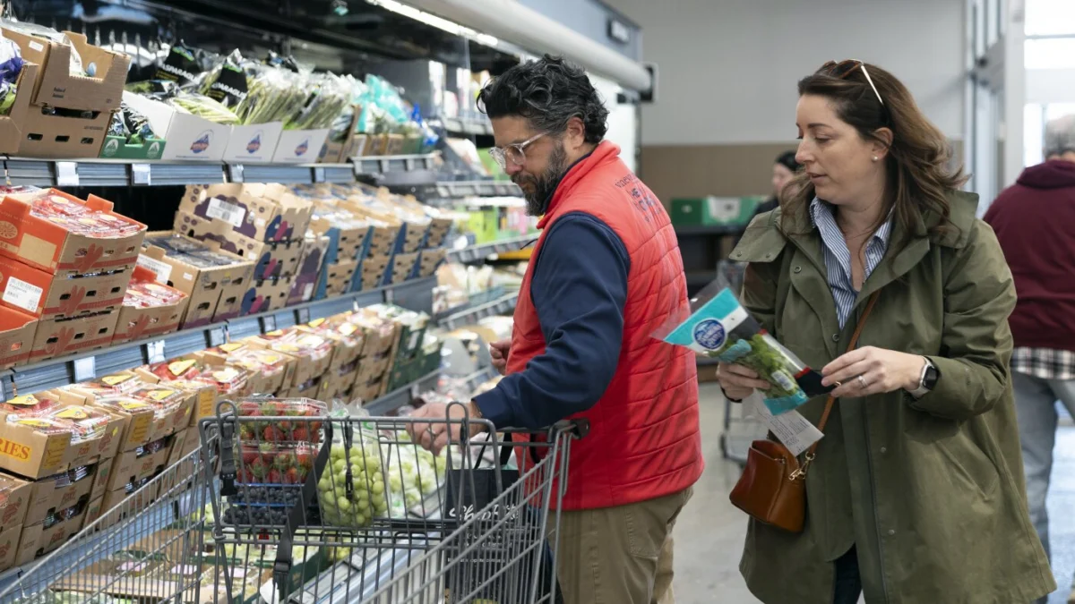 Rich Henderson and his wife, Rachel Negro-Henderson, shop for their family at the Aldi in Bellmawr, New Jersey. Rachel Wisniewski for NPR