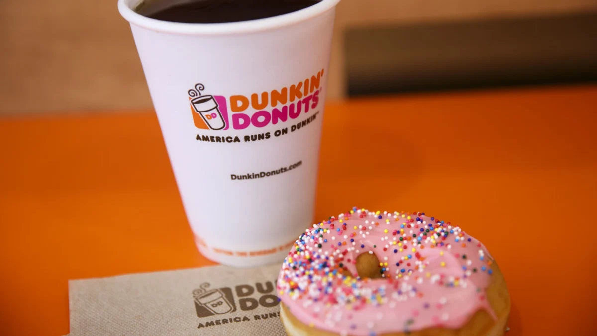 A cup of coffee and strawberry frosted donut with sprinkles at a Dunkin' Donuts location in Los Angeles, Sept. 6, 2017.