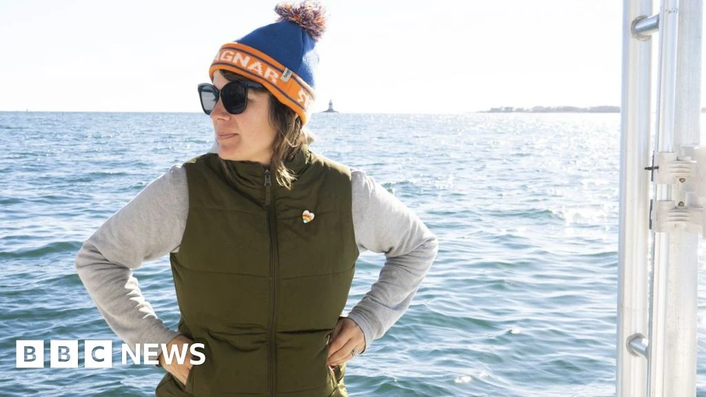 Suzie Flores on her boat, checking on her sugar kelp lines off the coast of Connecticut.