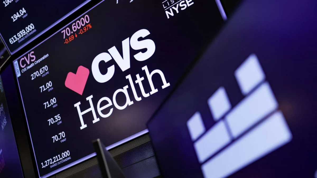 A screen displays the logo and trading information for CVS at the New York Stock Exchange, March 24, 2026.
