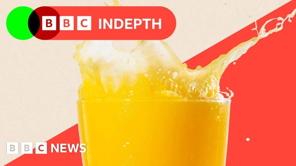 A carton of orange juice on a supermarket shelf, illustrating rising grocery prices.