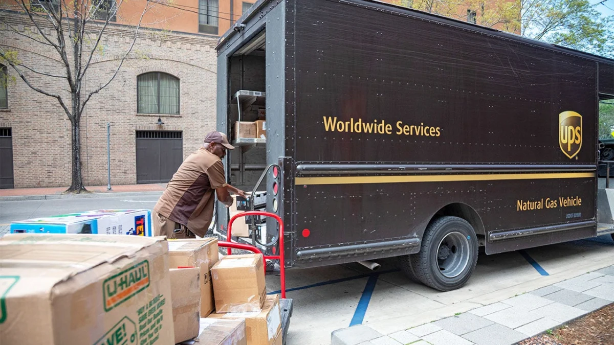 A United Parcel Service driver loads packages at the New Orleans Convention Center. (Jim West/UCG/Universal Images Group via Getty Images)