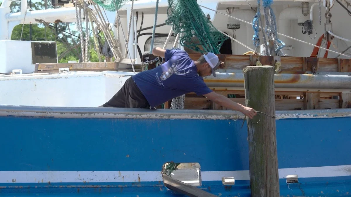 Shrimp boats are seen docked in Bayou La Batre, Alabama, as shrimpers face economic pressures from high fuel costs and tariff refund disputes.