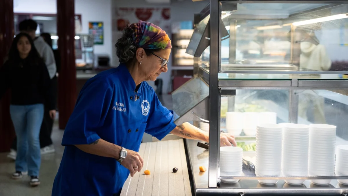 Jenifer Halin, culinary coordinator for the Great Valley School District, cleans the salad bar at Great Valley High School in Malvern, Pennsylvania. Districts across the U.S. are concerned about the rising costs of prepa