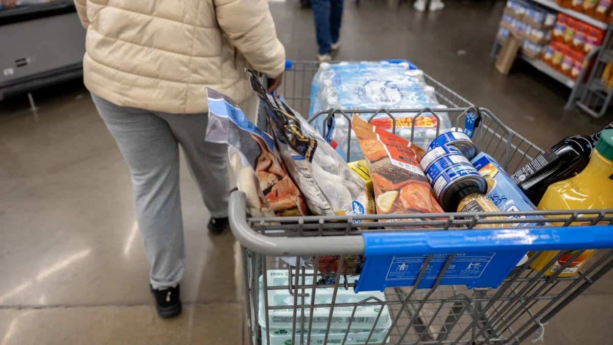 A customer shops at Walmart in Little Rock, Ark. Walmart plans to cut prices using tariff refunds as shoppers get skittish.