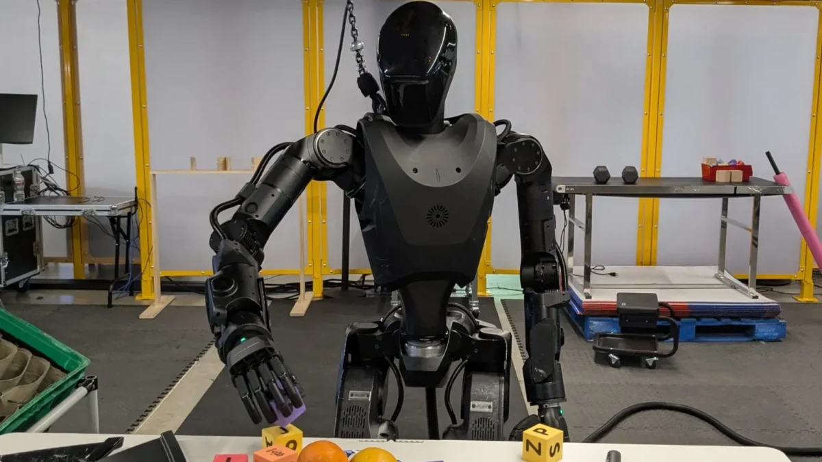 A Foundation Robotics Phantom humanoid robot undergoing testing, with engineers observing in a restricted facility.