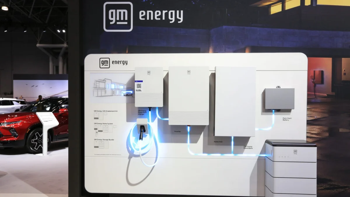 GM energy display at the New York International Auto Show illustrating its push into energy storage and vehicle-to-grid services.