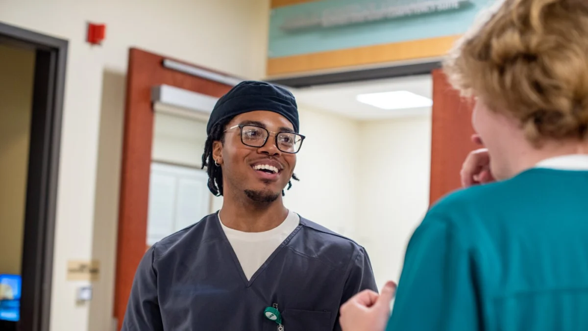 Nursing student Amiri Saadiq (left) talks with classmate Ethan Stinson in the simulation suite at the University of Alabama at Birmingham School of Nursing.