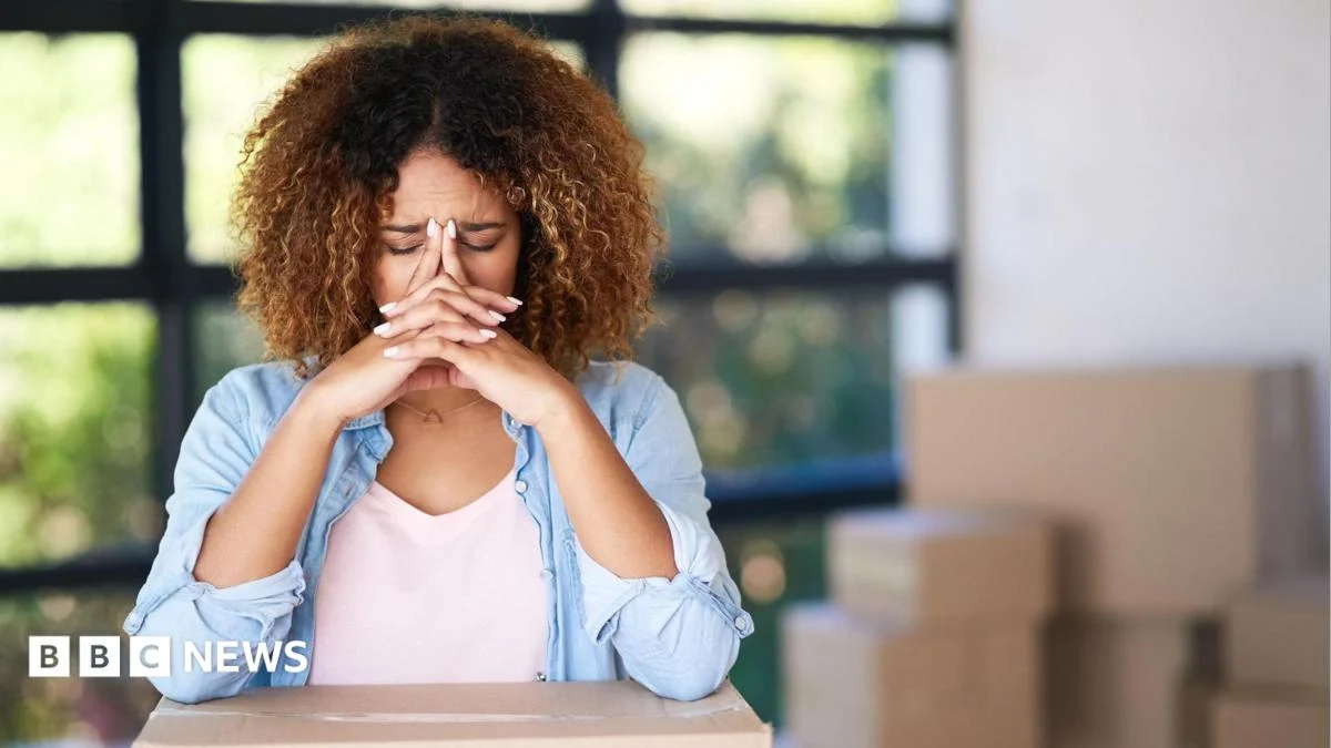 A couple considers a housing option as gazundering pressures buyers and sellers in England and Wales.